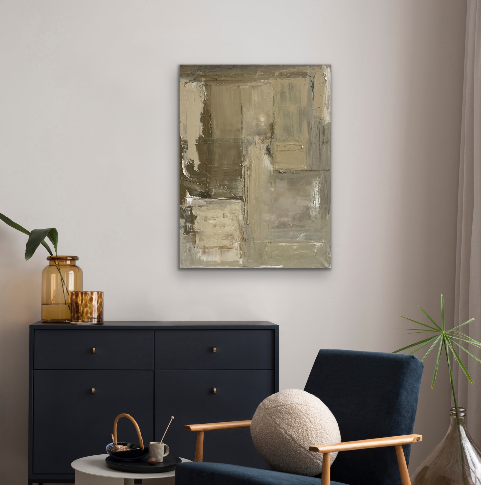 Modern living room with textured abstract art Greener Pastures by Caroline Adrienne Art, black dresser, and blue chair.