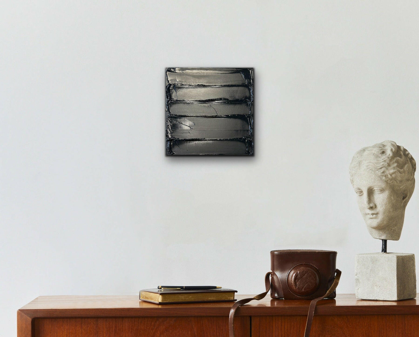 Mini Abstract Black: A small-scale abstract artwork in deep, rich black tones, designed to convey mystery and depth through simple yet powerful brushwork.