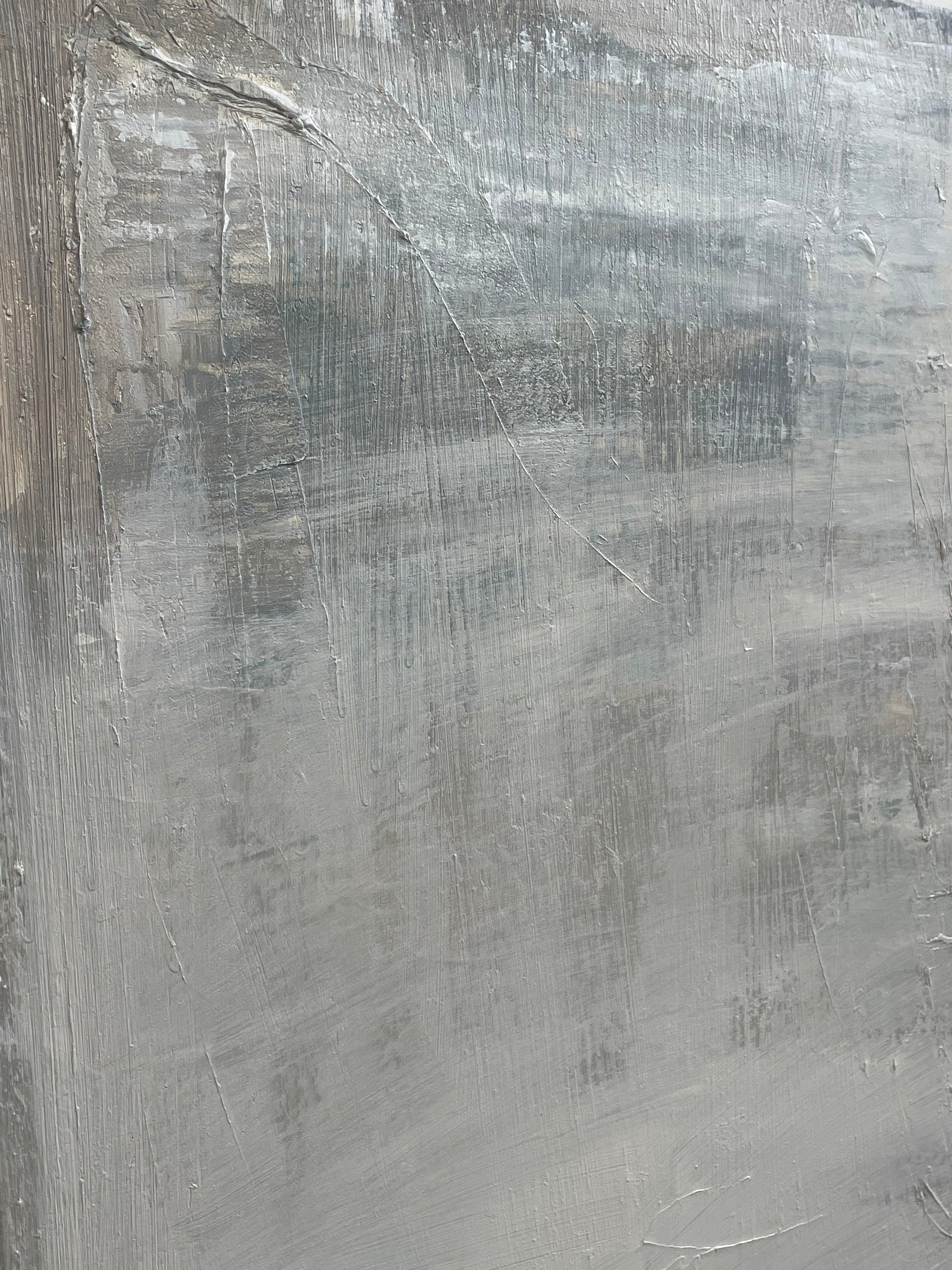 Close-up of a textured gray surface with brush strokes