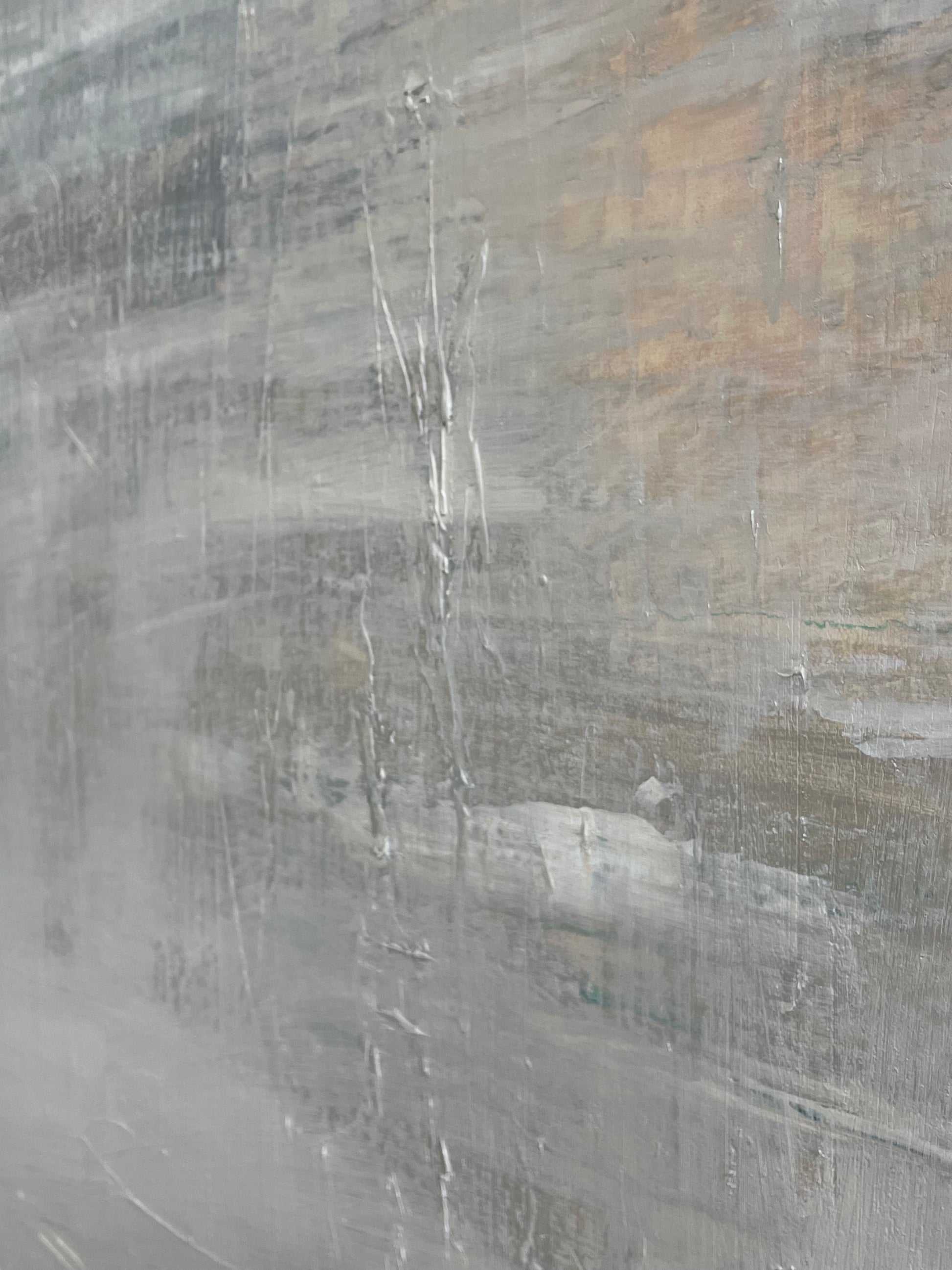 Close-up of a textured gray surface with subtle variations in color.