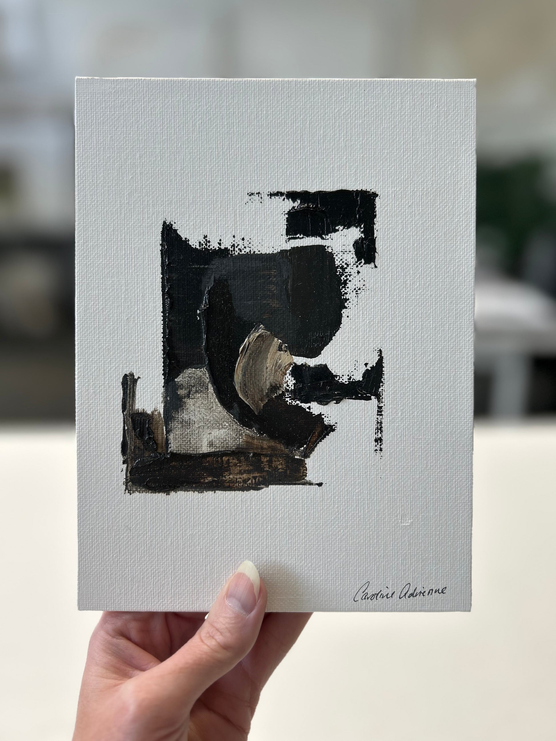 A set of three small abstract paintings, featuring a soft blend of neutral tones and minimalistic texture, perfect for compact spaces or smaller interiors.