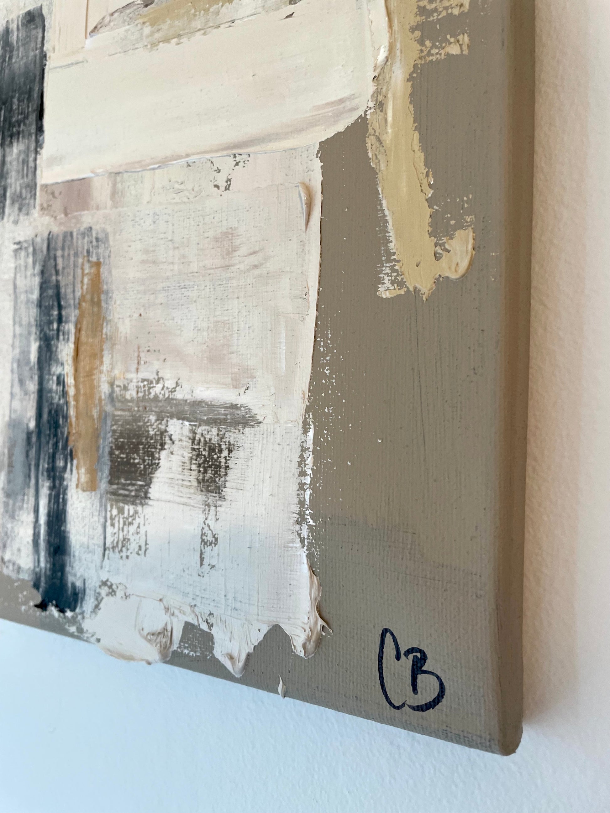 Abstract art piece with textural elements on a white surface