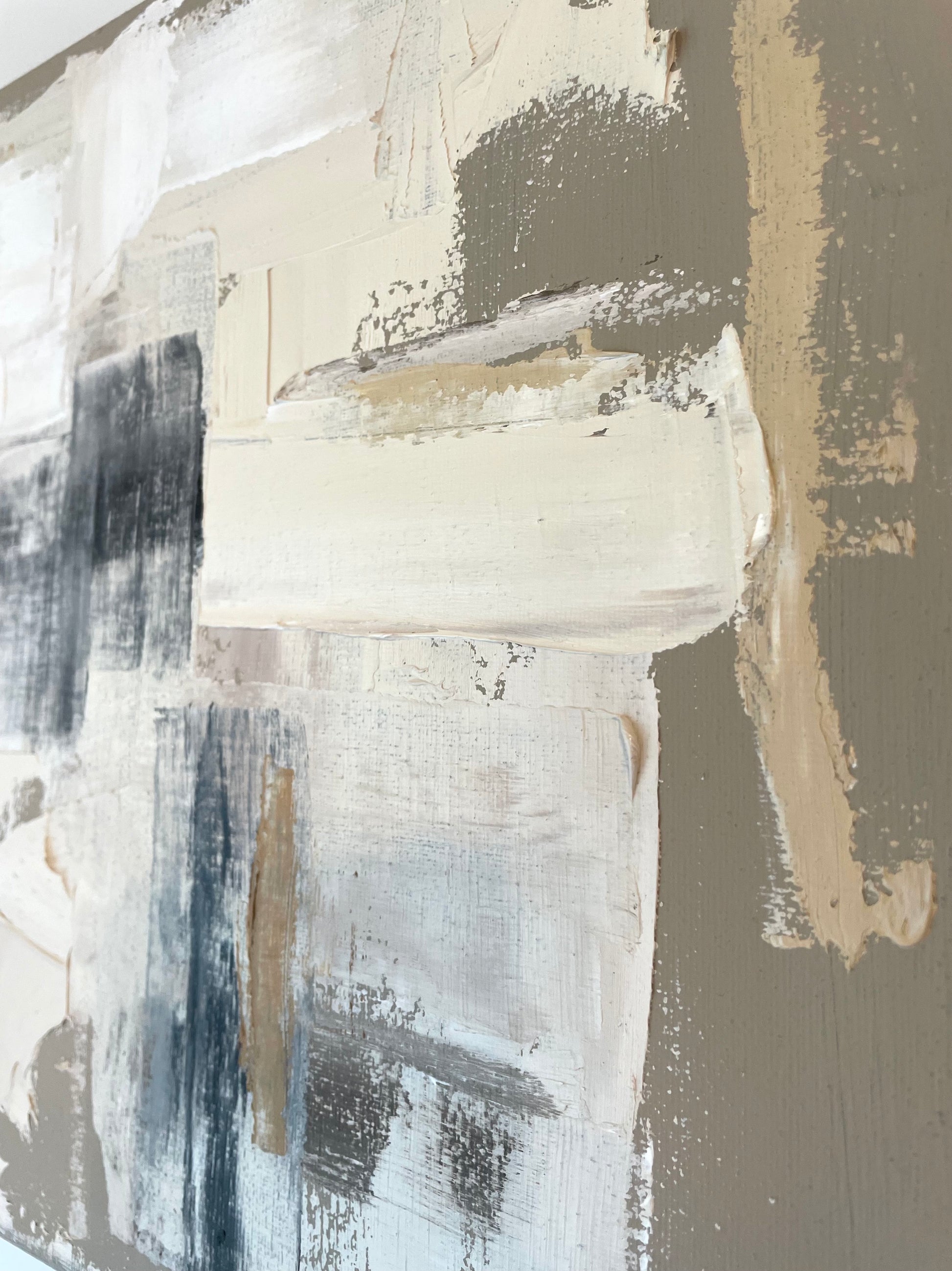 Abstract art with black, white, and beige brush strokes