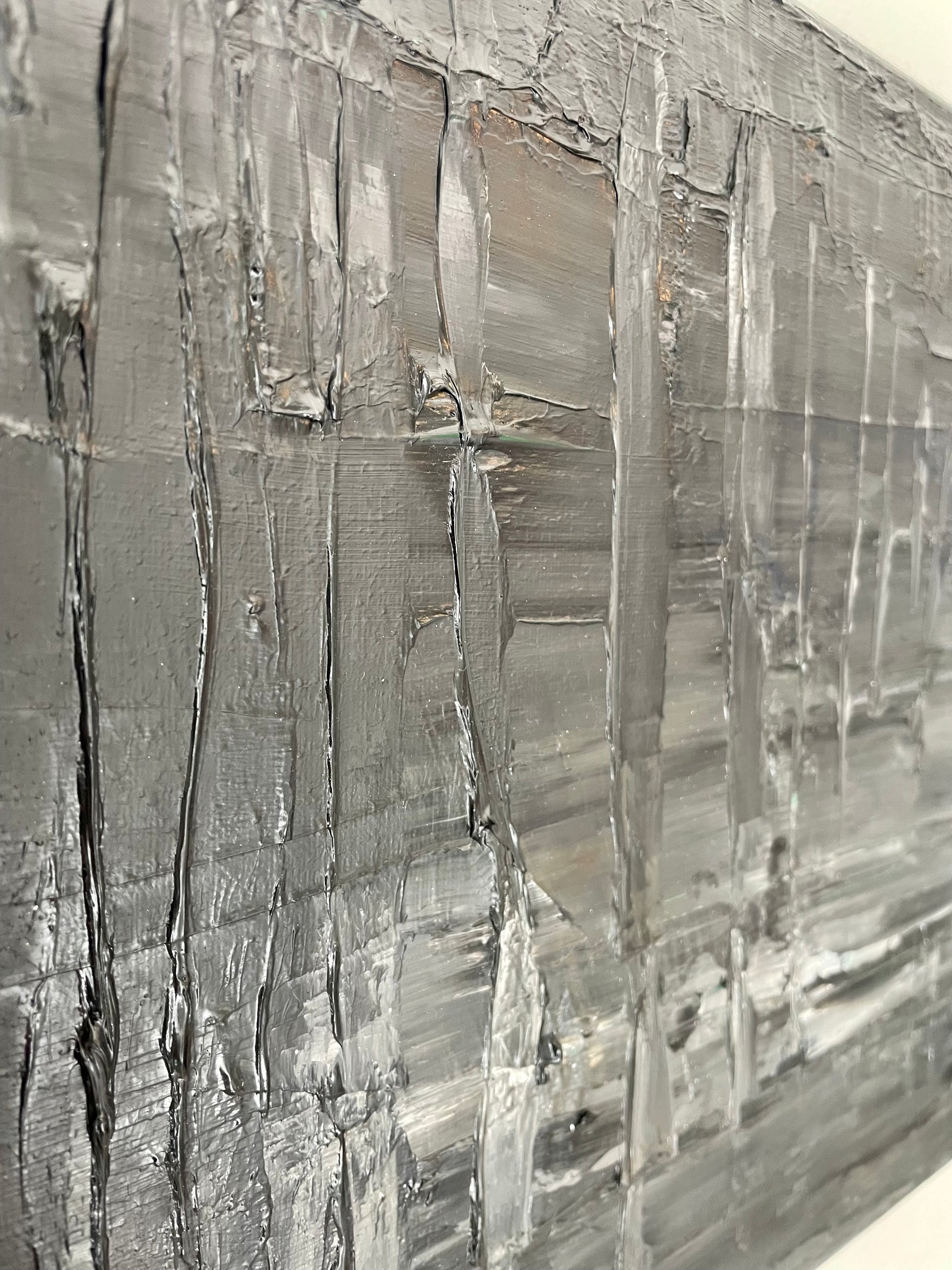 Close-up of a textured painting with horizontal lines