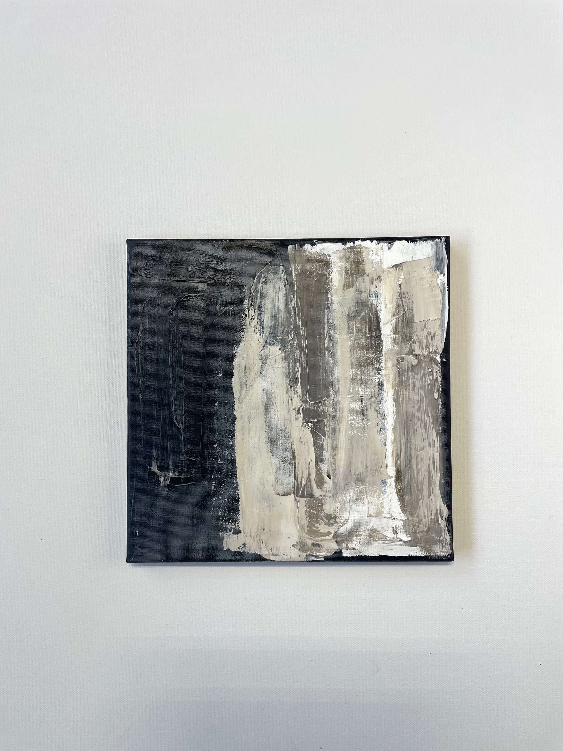 Abstract art piece with black and white brush strokes on a white background Caroline Adrienne Art