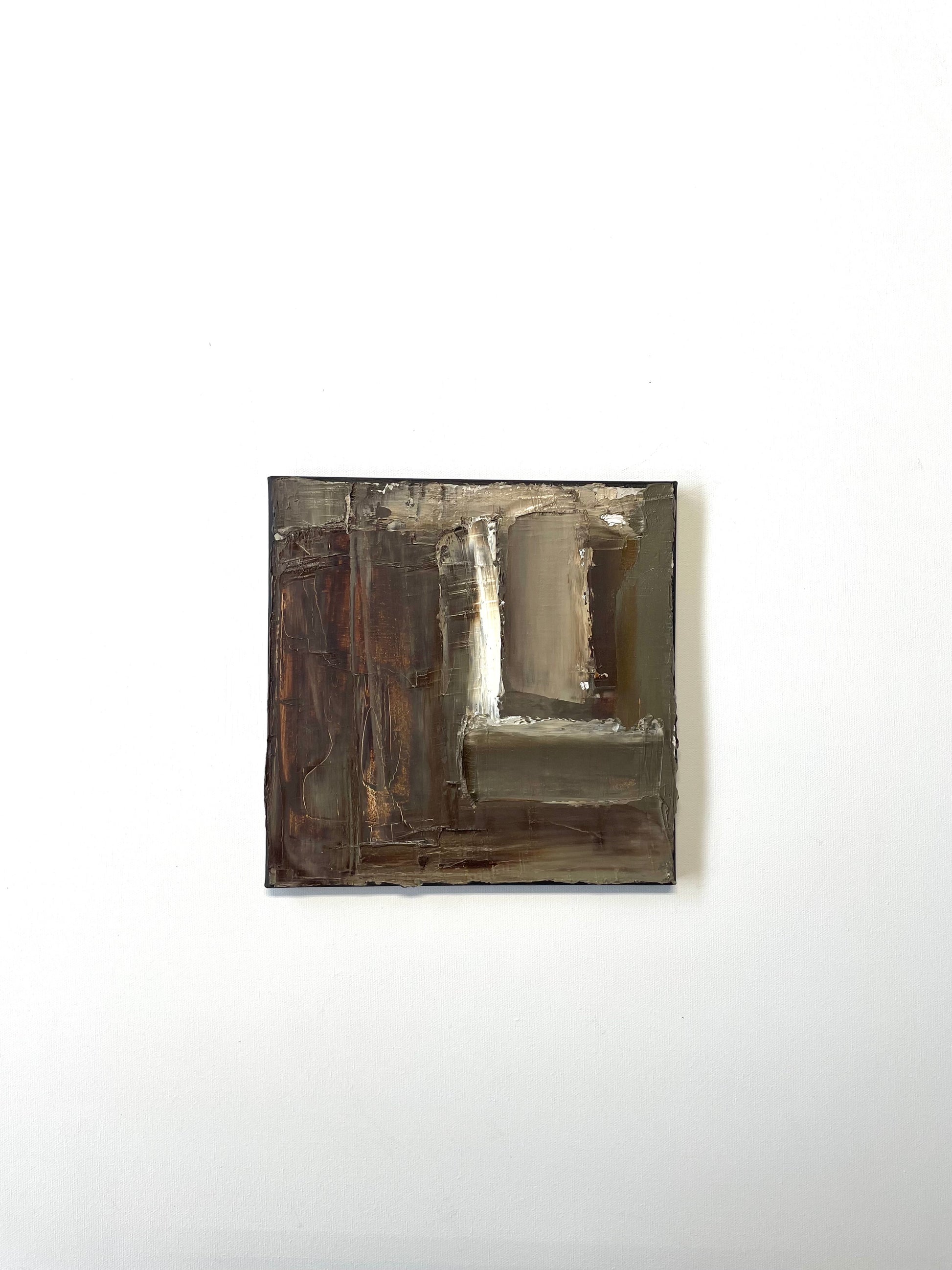 Square abstract brown painting by Caroline Adrienne with a textured surface on a white wall