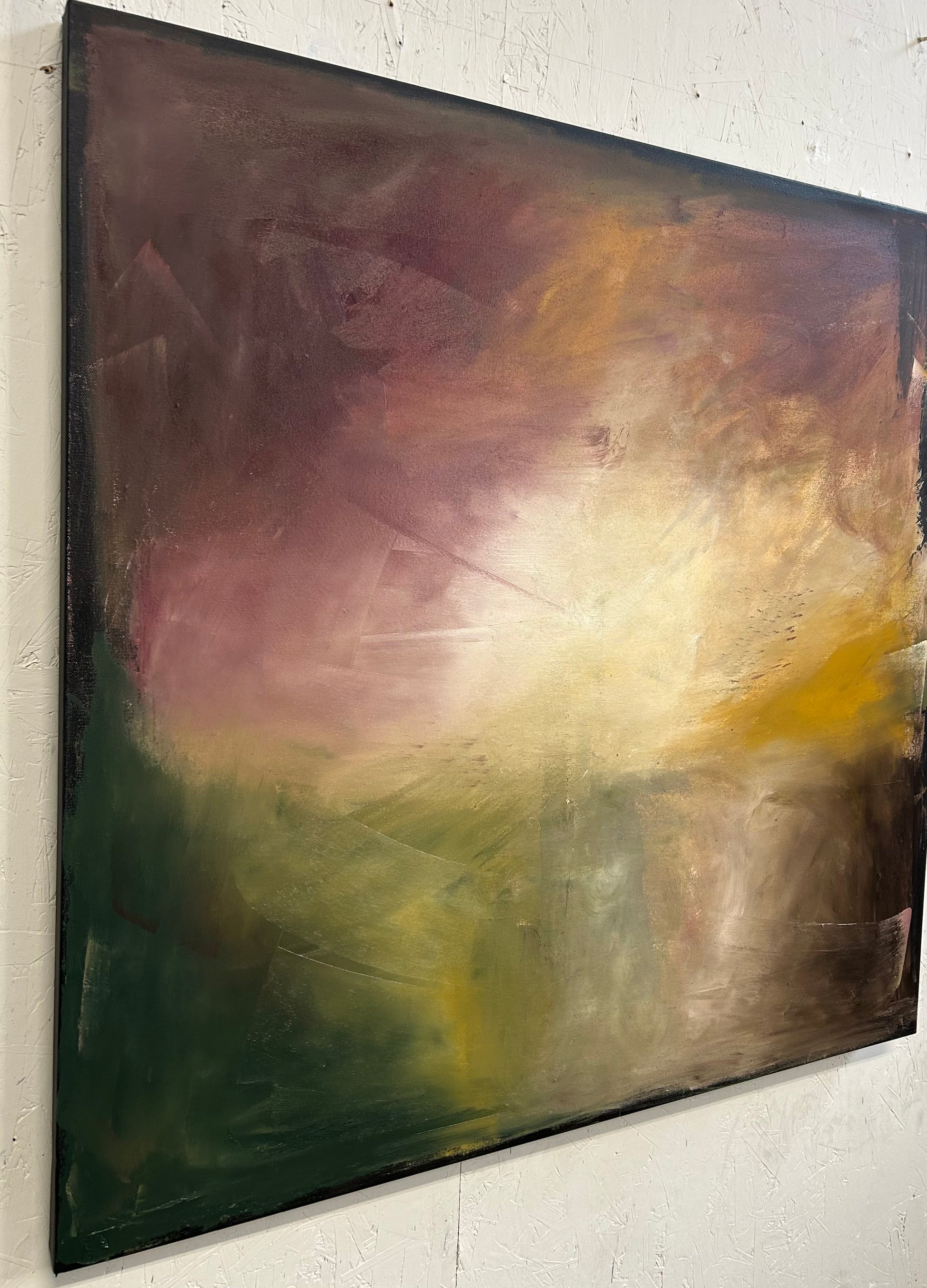 Abstract painting with a gradient of colors on a white wall