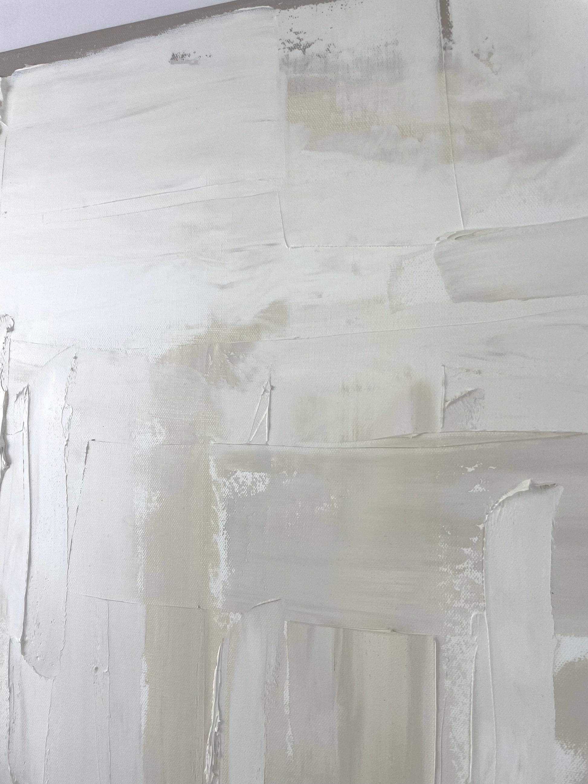 Close-up of a textured white surface with brush strokes