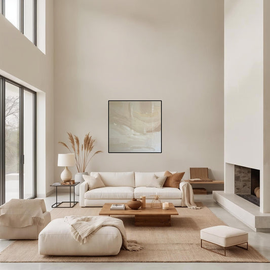 Modern living room with white sofa, wooden coffee table, and abstract art on wall.