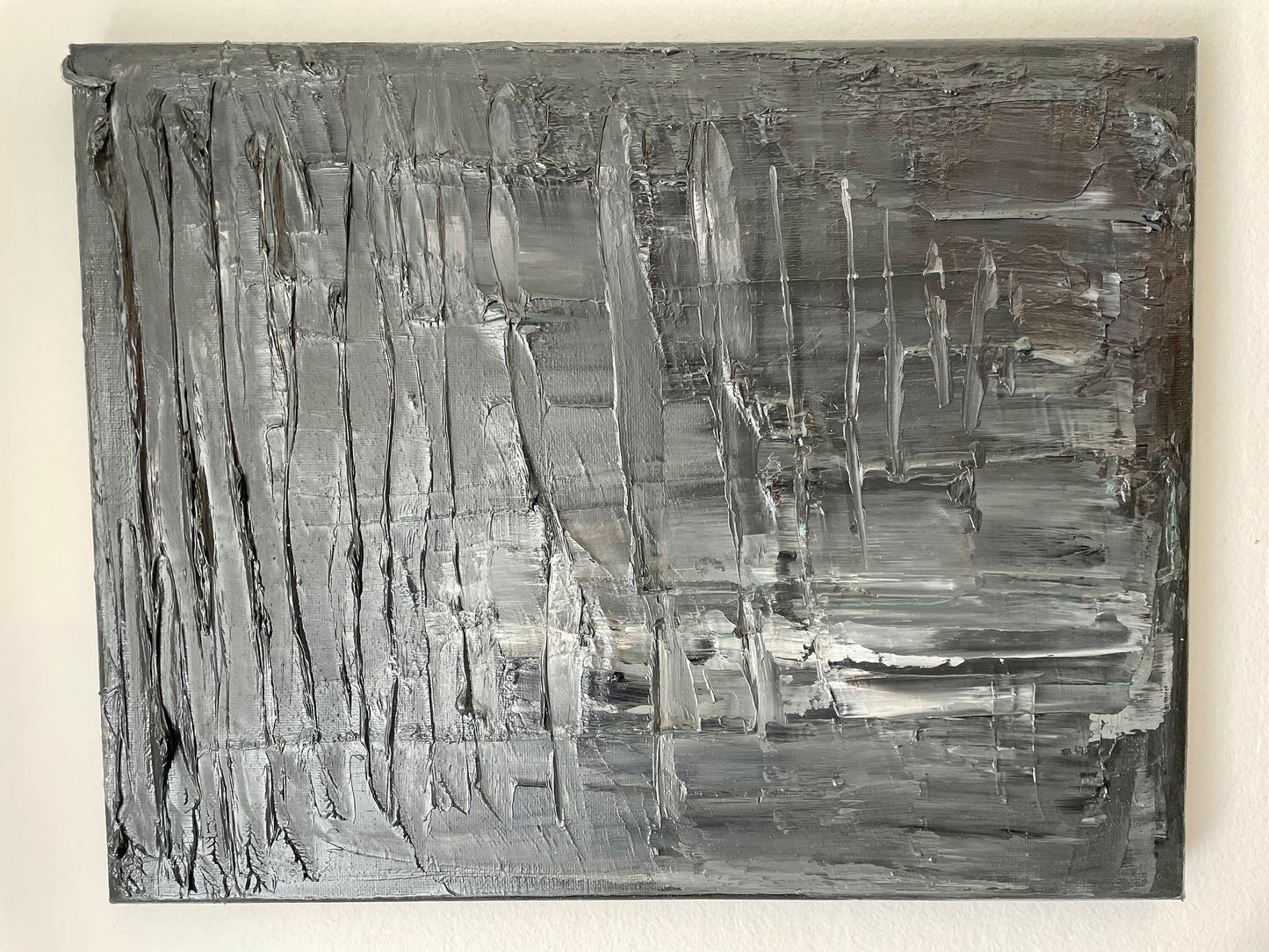 Abstract black and white painting on a beige background