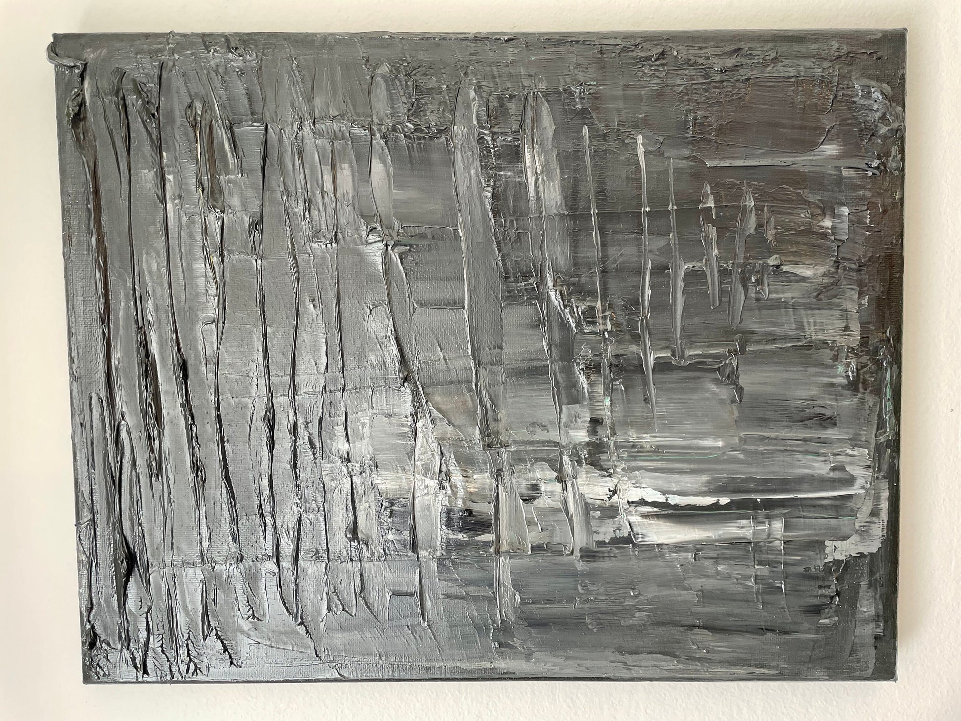 Abstract black and white painting on a beige background