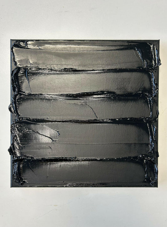 abstract textured oil painting black canvas on white wall by Caroline Adrienne Art
