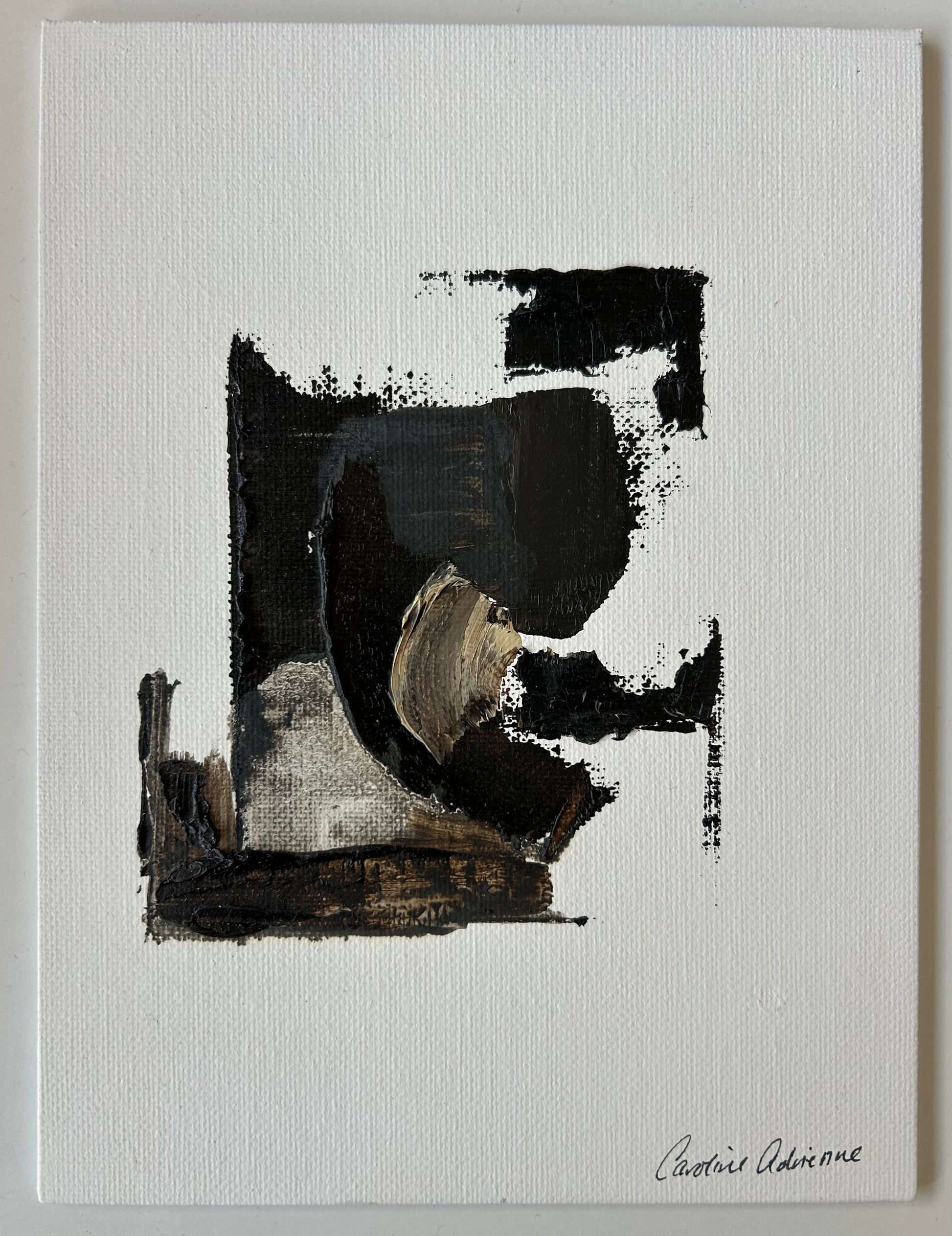 Abstract art piece with black and brown brush strokes on a white background